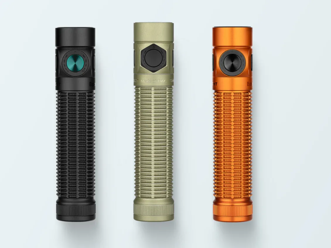 Three Olight Baton-series EDC flashlights in black, tan and orange, each with a side switch near the head.