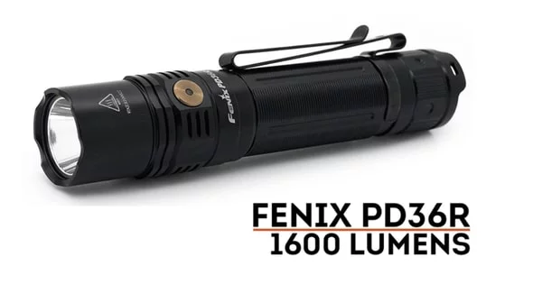 a black flashlight with a clip