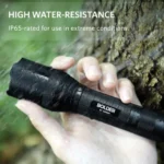 a hand holding a flashlight