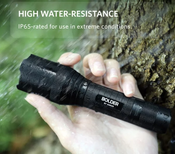 a hand holding a flashlight